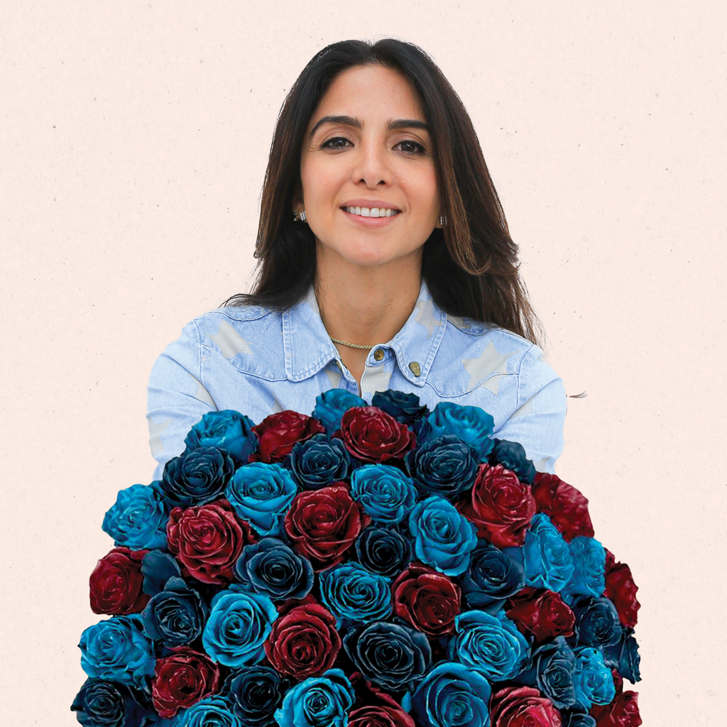 A girl is holding a Mystic Moon roses bouquet