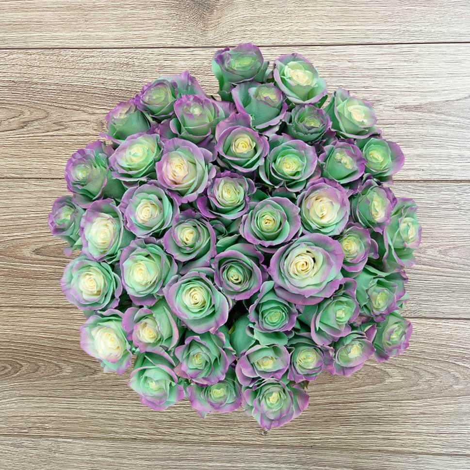 Aquamarine roses bouquet by Rosaholics