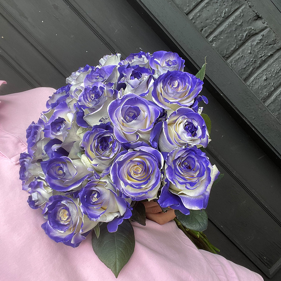 Purple Vaughn Special Rose Bouquet in hand