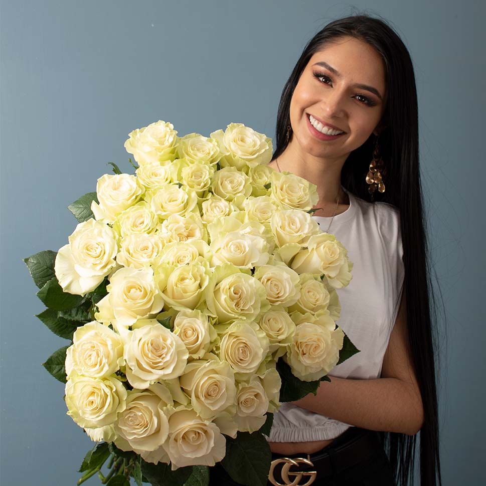 A young woman is holding a Casablanca bouquet - White Roses 